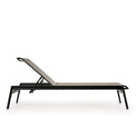 Side view of outdoor aluminum and sling chaise lounge and a half in dark color frame and neutral sling