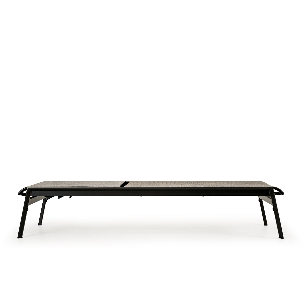 Side view of outdoor aluminum and sling chaise lounge and a half in dark color frame and neutral sling, backrest in fully flat position