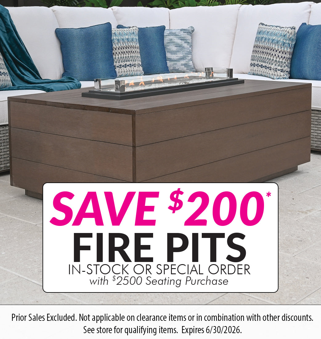 Outdoor fire pit table with promotional sign for saving $200 on fire pits.