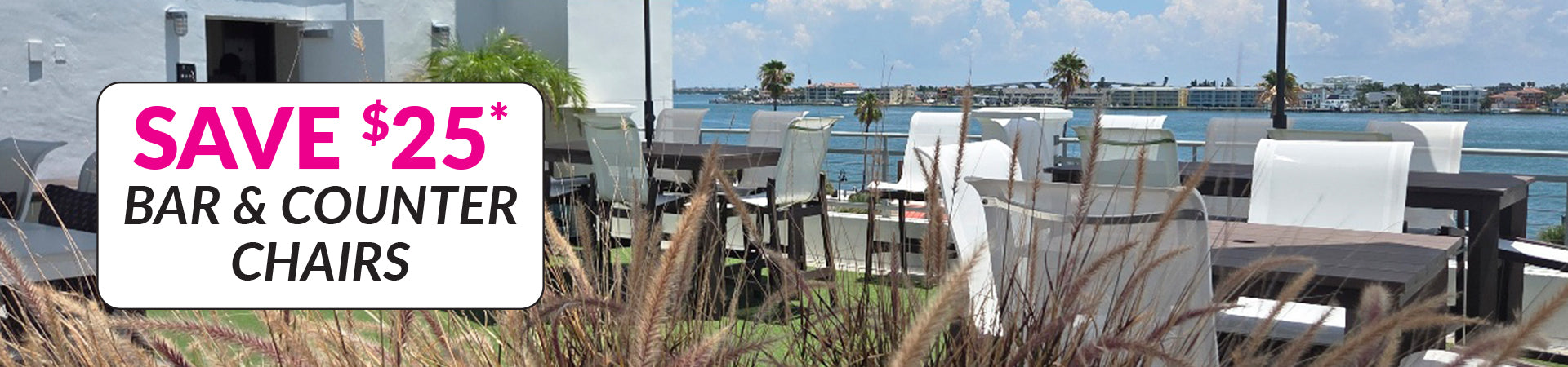 Outdoor patio bar seating area with white bar stools and counter chairs, ocean view in the background, and a large promotional sign reading 'SAVE $25* BAR & COUNTER CHAIRS'.