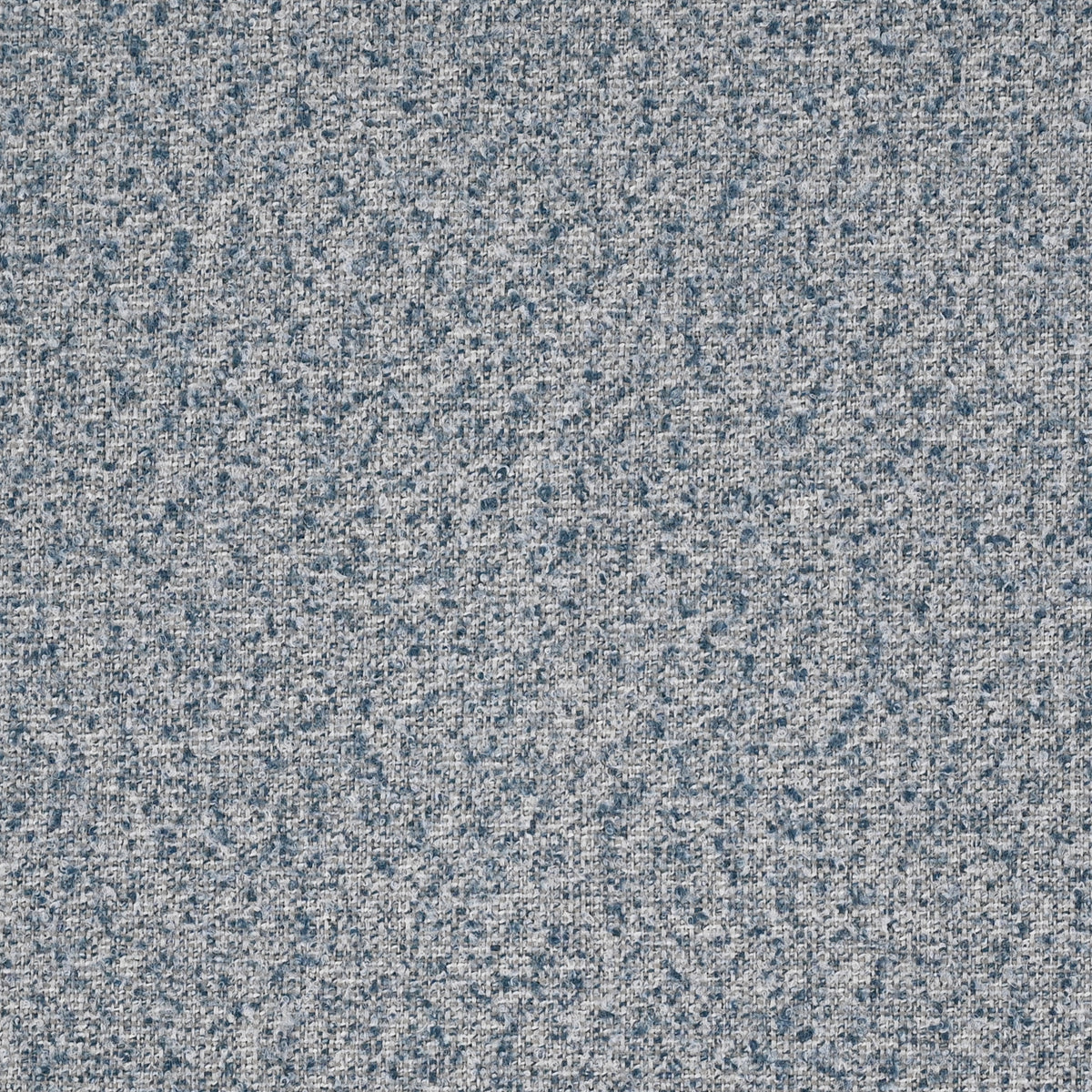 textured upholstered fabric in dark, medium and light blue
