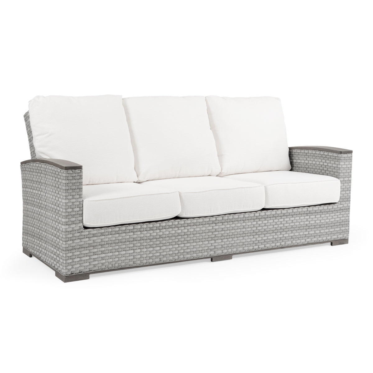 A beige outdoor wicker sofa with white cushions.