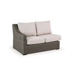 Outdoor Woven Left Facing Arm Loveseat with two seat cushions and two back cushions.