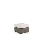 Outdoor Woven Rectangle Ottoman with cushioned top.
