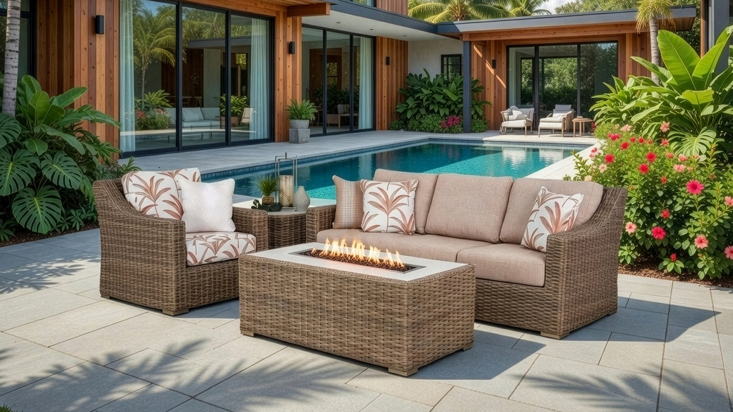 Outdoor patio with wicker furniture, fire pit, and pool area.