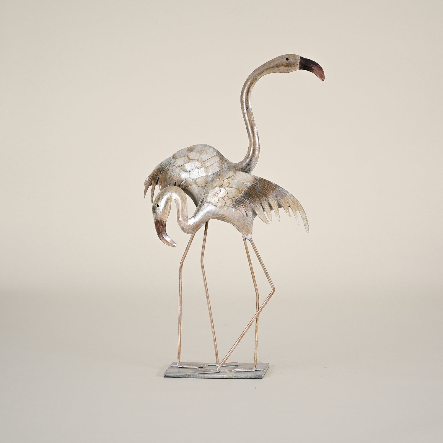 Two Metal Flamingos on a Flat Stand
