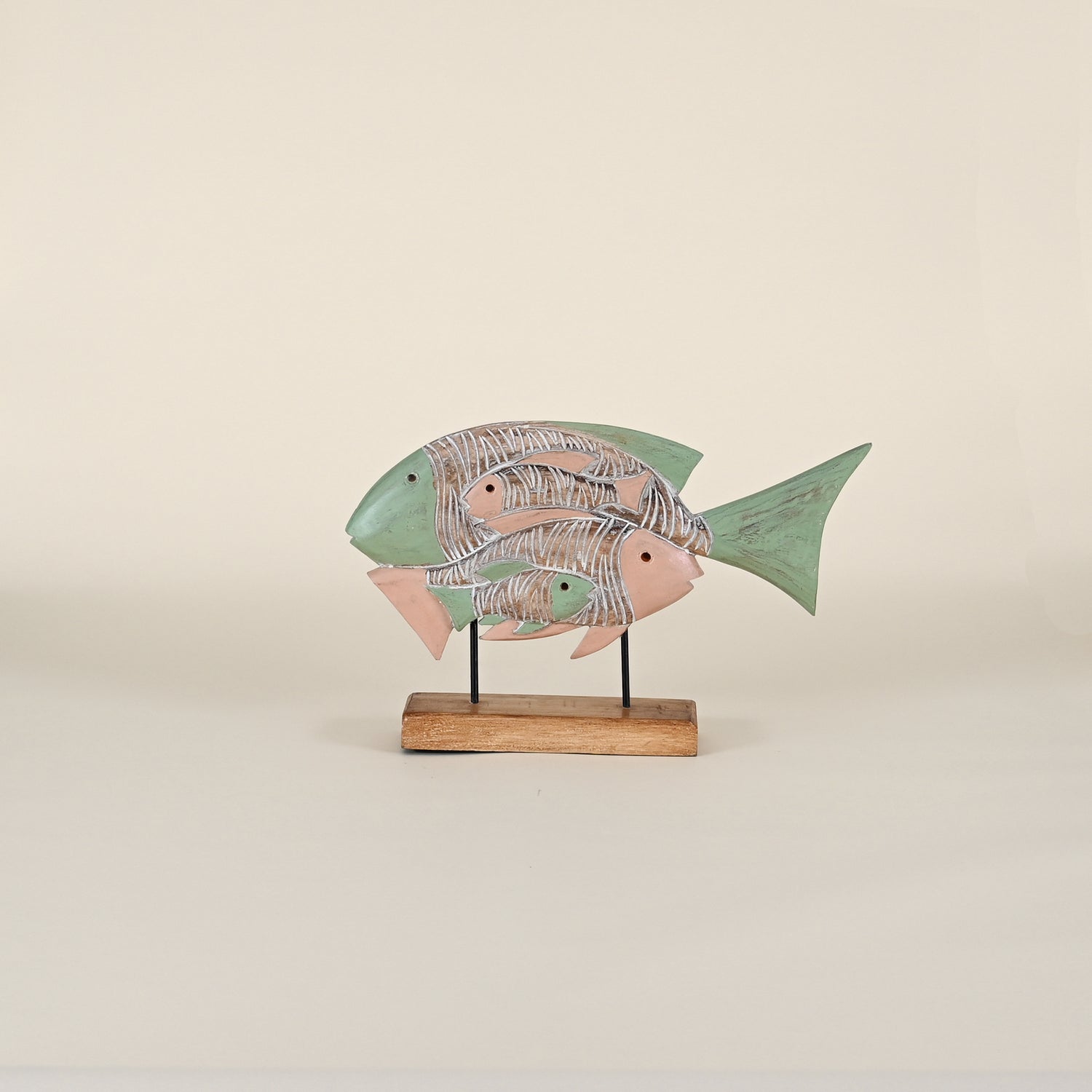 Four Fish on a Wood Base Facing Opposite Directions