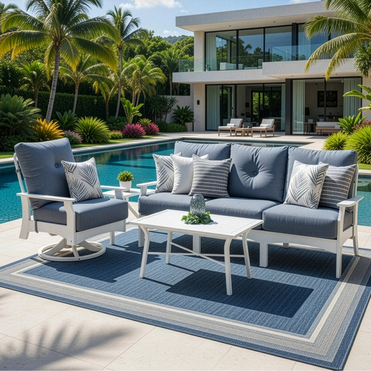 Outdoor marine grade polymer cushioned seating set on a patio next to a pool