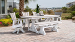 Outdoor poly timber dining set on pavers near the water with four chairs and a bench around a rectangle dining table